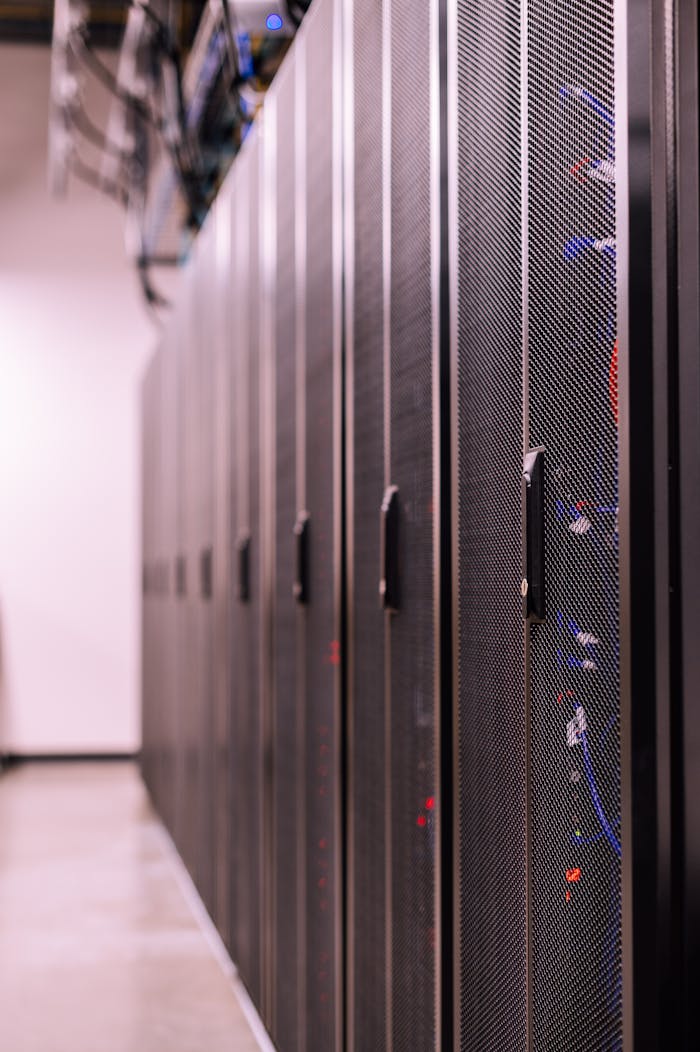 About Detailed view of network server racks in a modern data center, highlighting technology infrastructure.